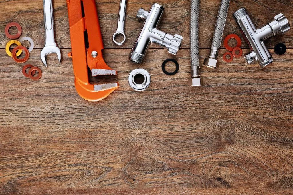 plumbing tools on the table - Wrench It Up plumbing and mechanical