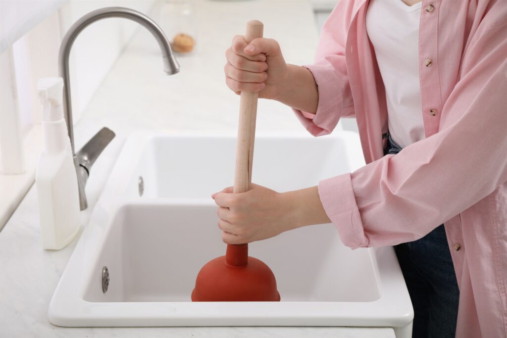 replace kitchen sink strainer done by Wrench It Up plumbing and mechanical