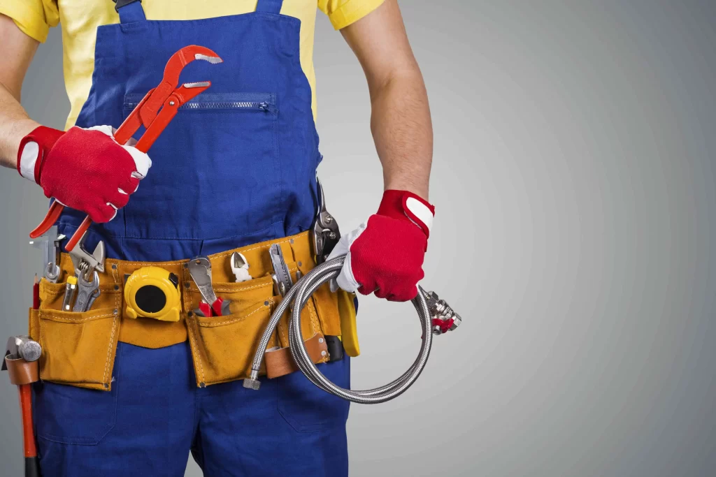 plumber with tools - Wrench It Up plumbing and mechanical